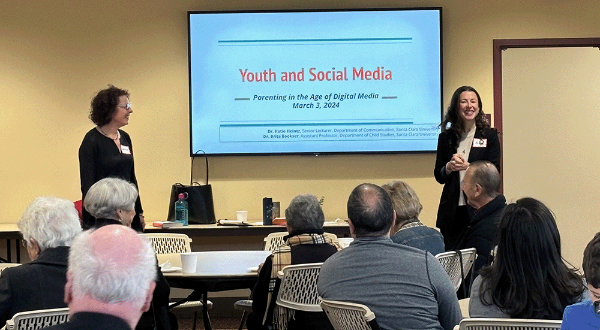 Katie Heintz and Brita Bookser giving a presentation on Youth and Social Media
