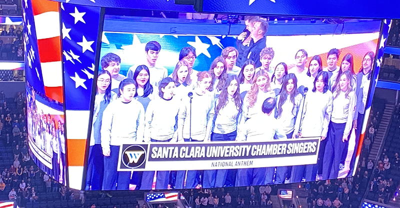 On the jumbotron SCU Chamber singers performing the National Anthem at the Golden State Warriors game on Frebruary 11, 2026