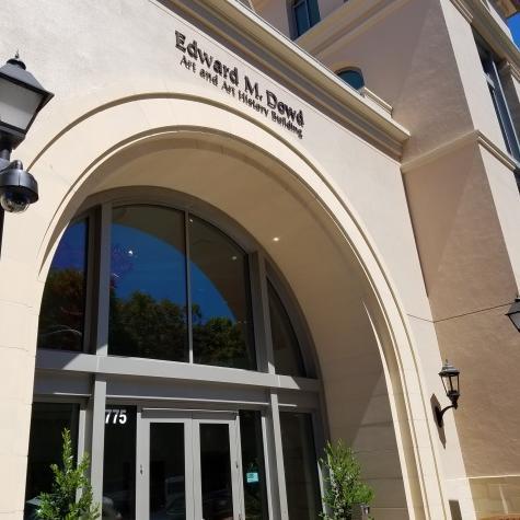 Alt text: Entrance of a building with the sign 