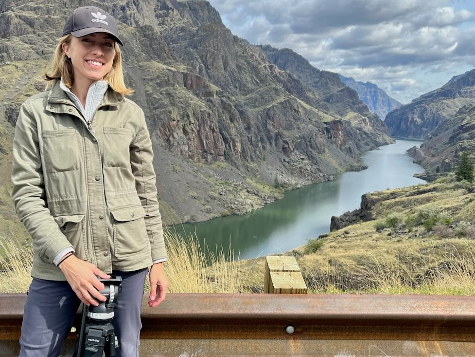 Maggie Beidelman standing at far left with the canyon and river in the background.