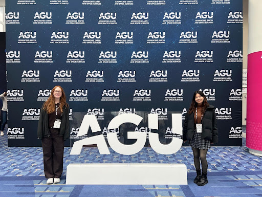 Students with AGU 2024 standing in front of AGU background