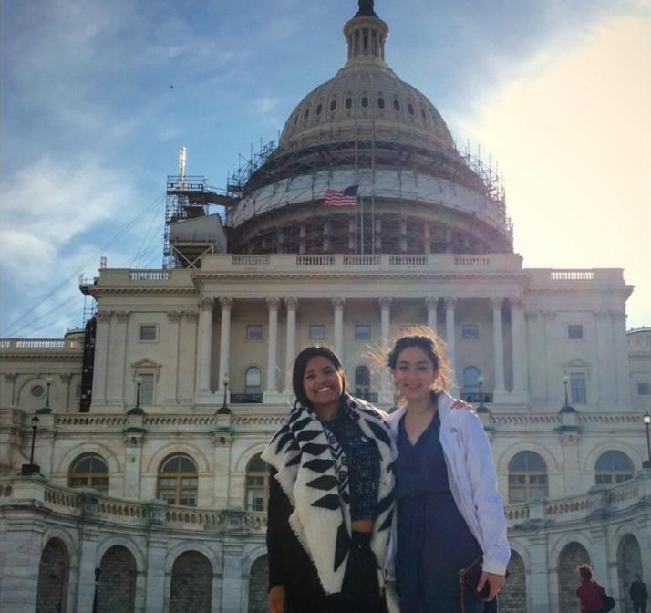 A man and woman standing in front of a large domed building. image link to story