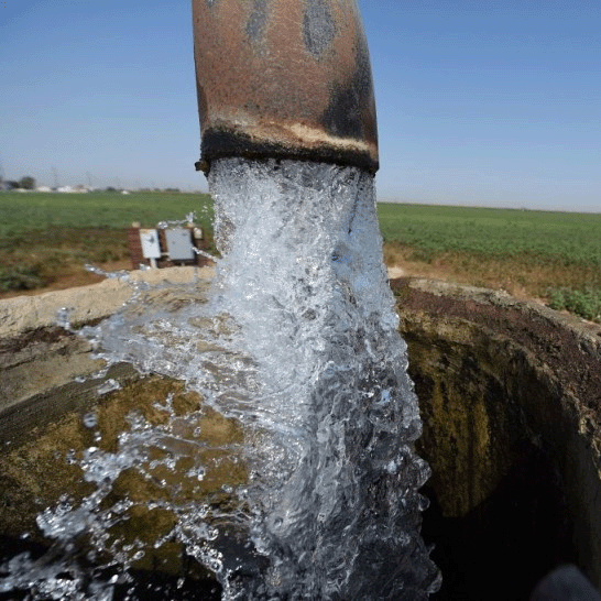 Water flowing from a well in the Central Valley