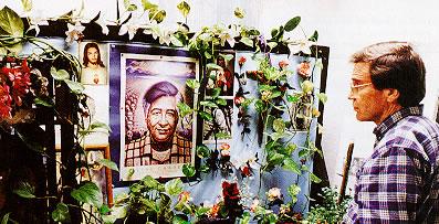 A person looks at a display of decorated posters.