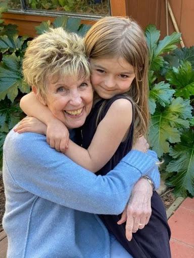 Jo Burr Margadant hugging granddaughter