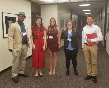 Five people with name tags at History Honor Society Conference.