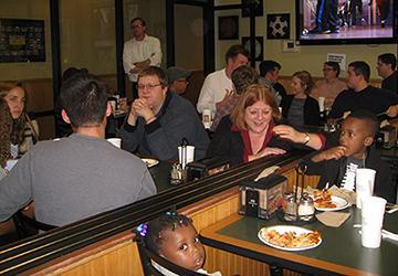 Alt text: People dining and conversing at