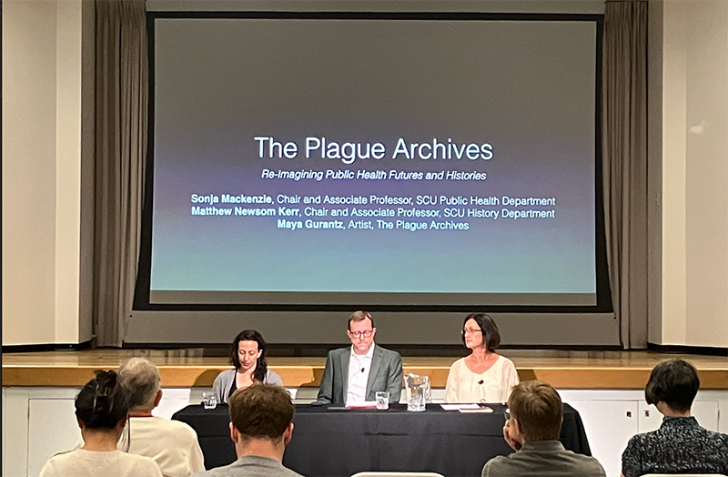 A panel presents on The Plague Archives