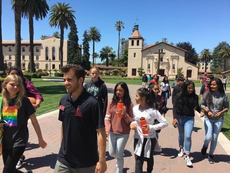 Group of people walking outdoors, titled mathcamp2017 1. image link to story
