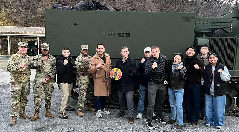 Group standing in front of Bunker Buster