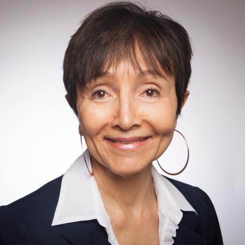A woman smiling in a professional headshot. image link to story