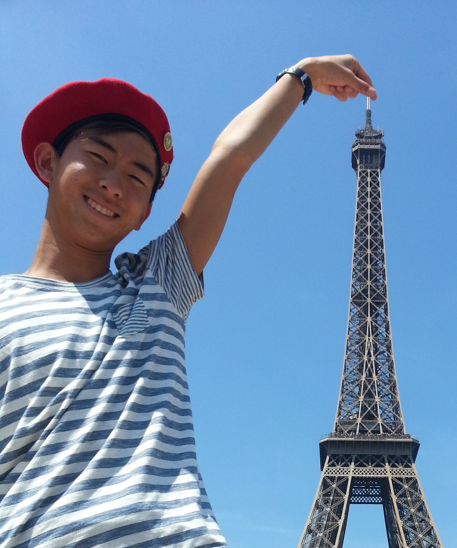 James Wang with Eiffel Tower in Paris image link to story
