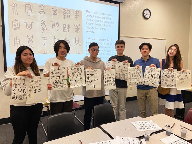 Students with their caligraphy