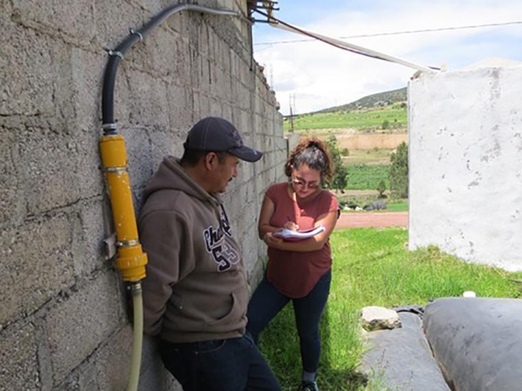 Julieta is interviewing a customer on his farm in Tlaxcala