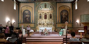 Liturgy in the Mission Church facing the altar