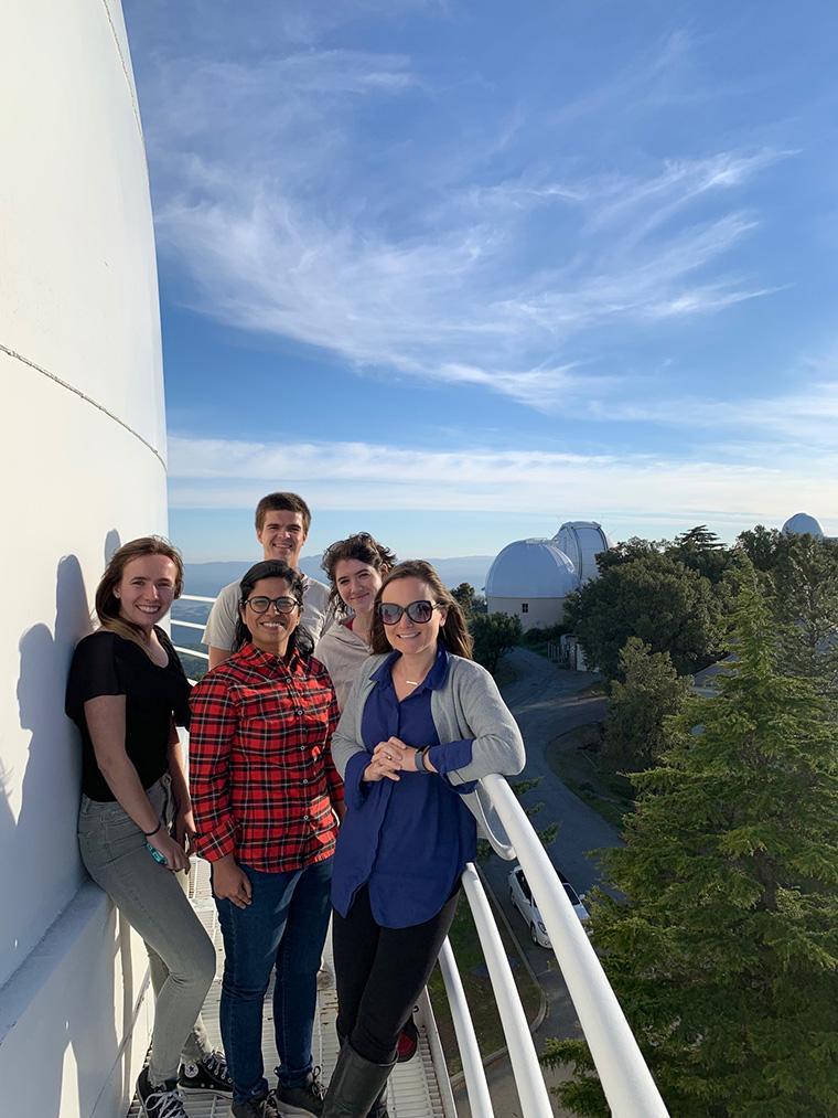 SCU astrophysicist Kristin Kulas (far right) with current SCU students and  NASA colleagues on the catwalk of the Shane Telescope at nearby Lick Observatory.