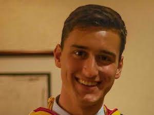 A person named Jesse in graduation attire smiling. image link to story