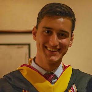 A person named Jesse in graduation attire smiling. image link to story