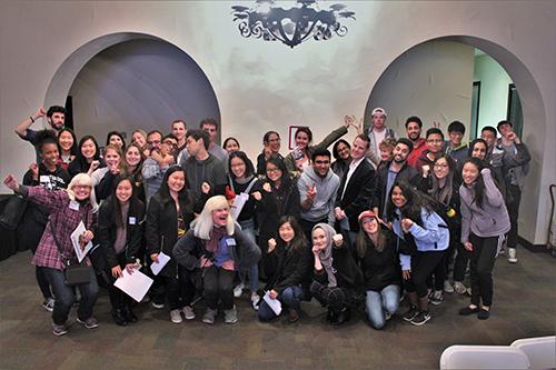 A large group of people posing together indoors.