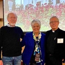 Three individuals posing together at the AMPineda RSM Lecture 2022.