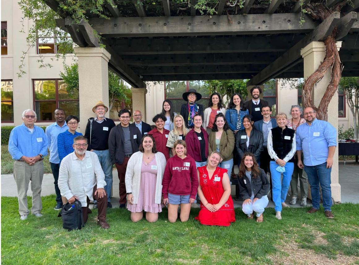 A group of people posing for a group photo outdoors at RS annual reception 2022.