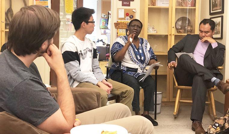 Teresia Hinga and Roberto Mata with students. image link to story