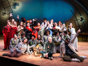 Brian Thorstenson on Mayer Theatre stage with the cast of overhead, a skylark callead