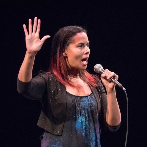 Rhiannon Giddens in concert. Photo by Chuck Barry. image link to story