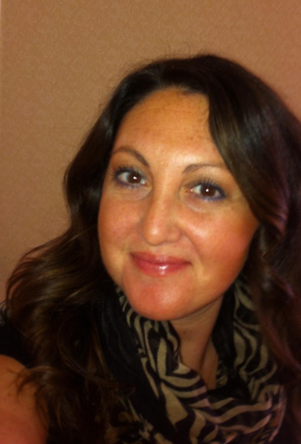 A woman smiling at the camera.