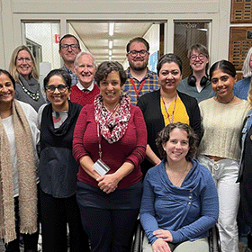 Sociology and Anthropology Departments and friends celebrate Greg’s bright future. Greg Walswick, rear right center in blue and yellow plaid shirt. image link to story