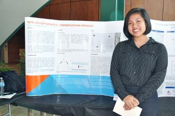 Amanda standing next to a presentation board.