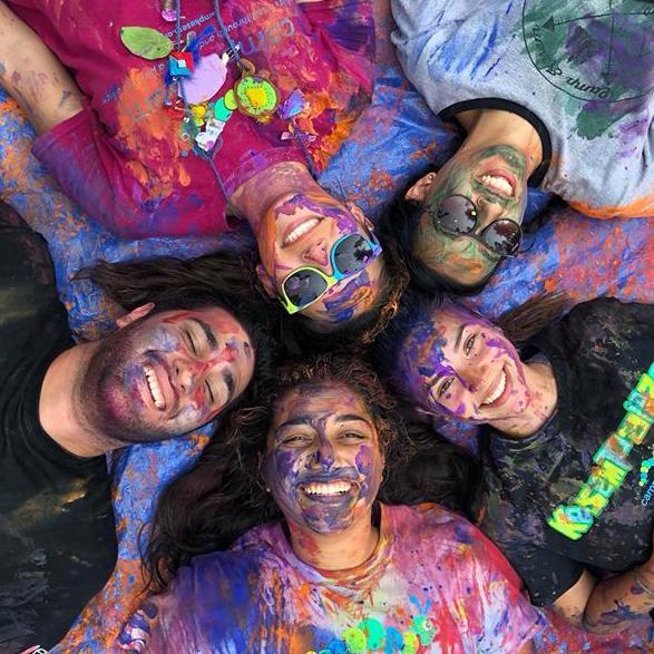 Camp Kesem counselors covered in paint