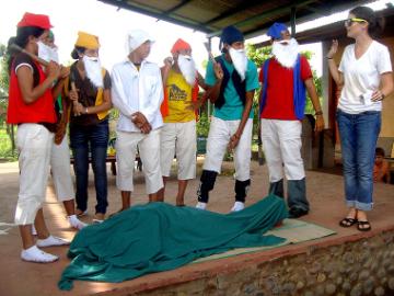 People in costumes rehearsing a scene for Snow White production.