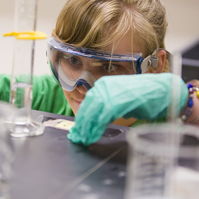 SCU student working in the lab preCOVID