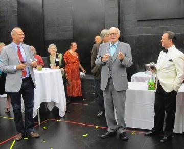 A group of people at an event making a toast.