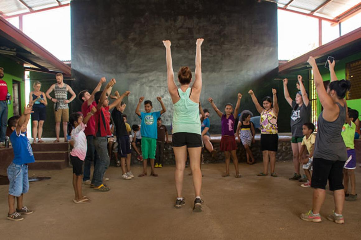People standing in a theater with arms raised, titled Teatro Catalina 2017. image link to story