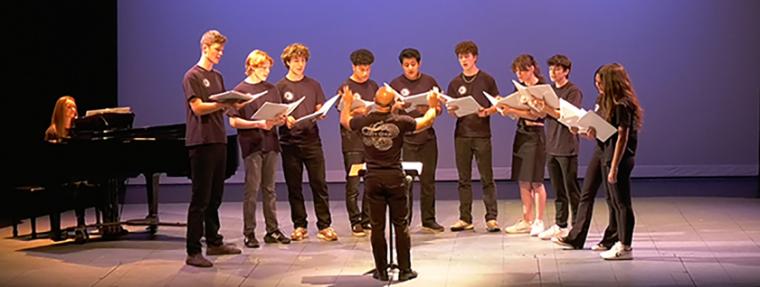 Tony Asaro conducting high school choir