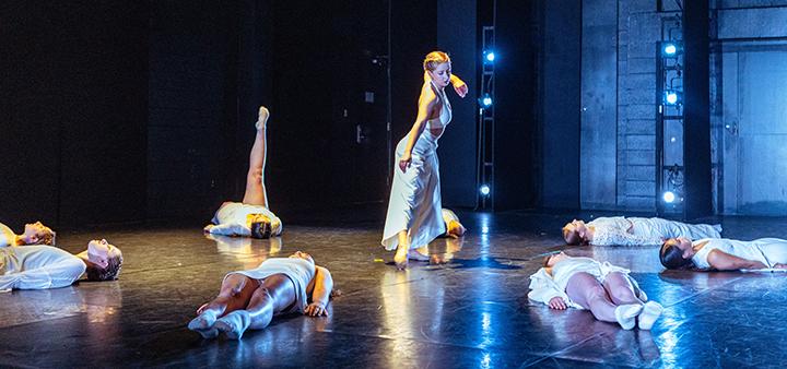 3 women in long pale blue dresses dancing onstage