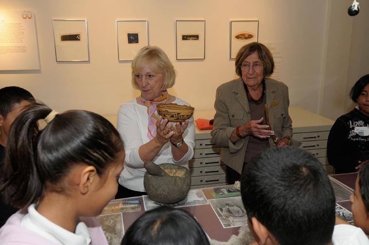California History docents show objects to students at the Touching Cart.