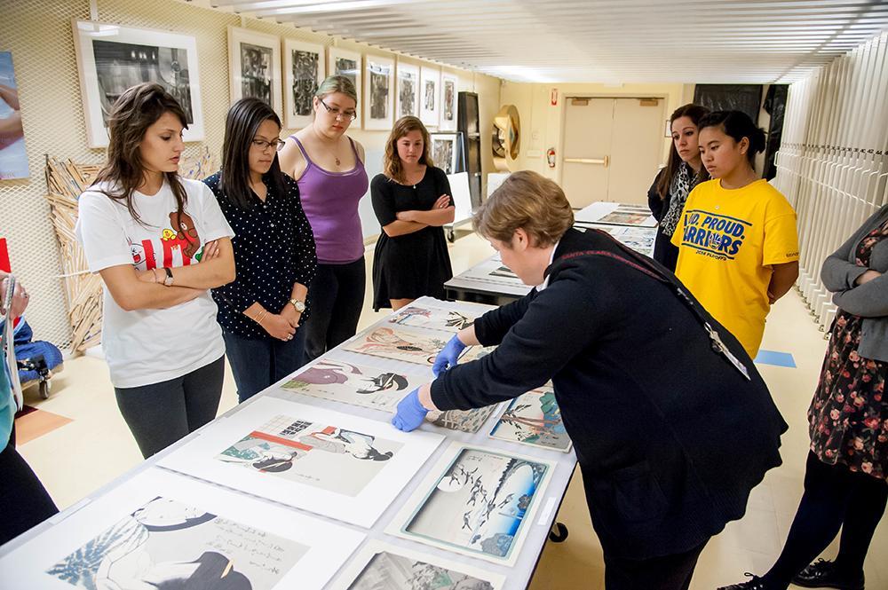 Collections Manager shows students Japanese prints from the collection.