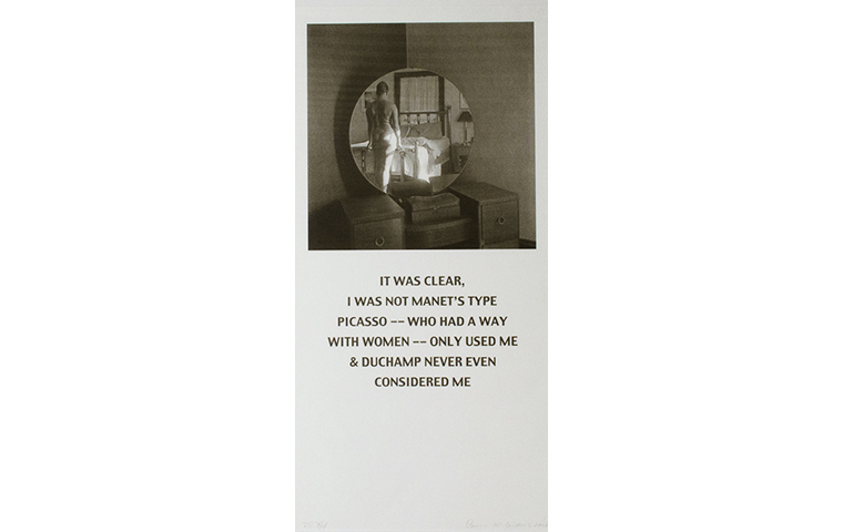 Black and white square photograph of a bedroom vanity with the mirror reflecting a nude figure's back. The square is located at the top of the photo paper. Below the photograph, large text reads: 