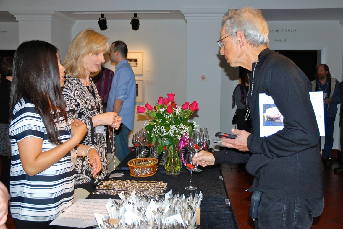 A museum member is welcomed to a member event.