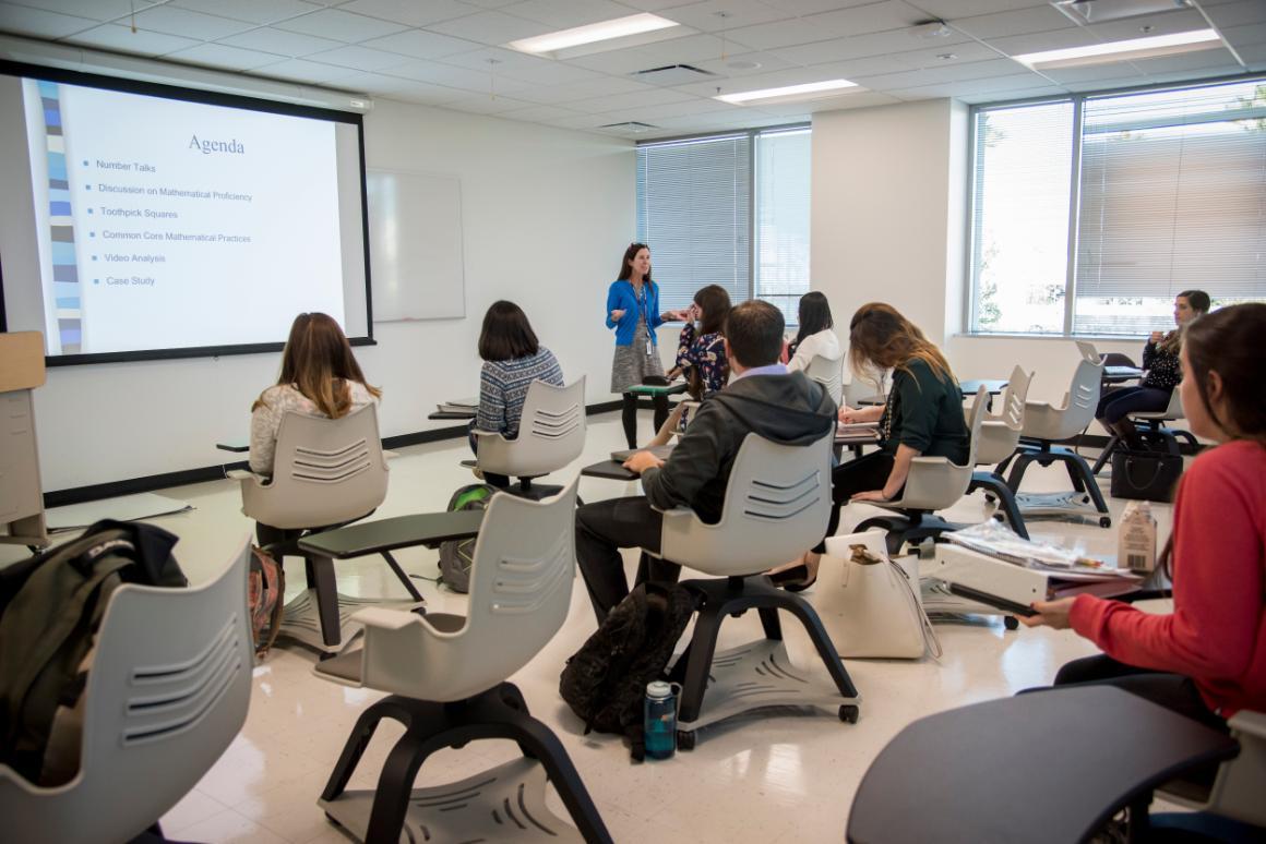 A photo of classroom with students and faculty 