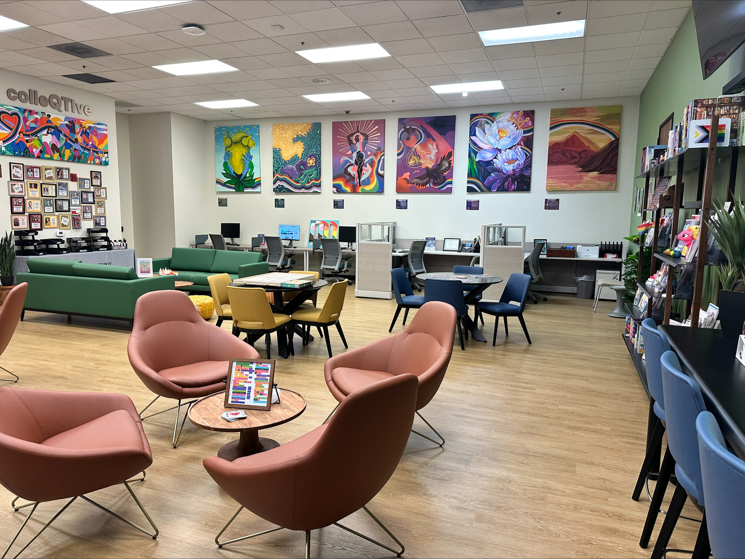 With the intention of curating a warm, colorful space so everyone who walks in feels welcome, the clinic worked with local queer and trans artists to create artistic representations of the clinic's values, including liberation, community, and joy. The art series is shown here on the walls of the clinic lobby.