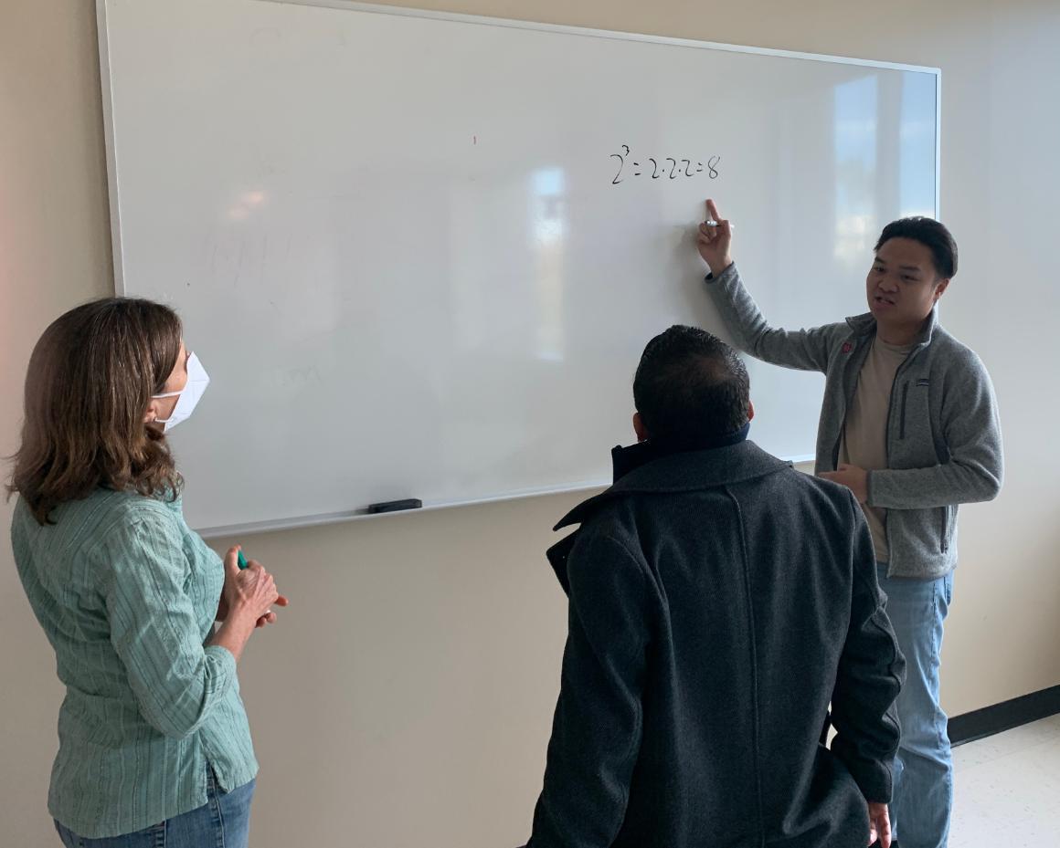 Noyce Fellowship Workshop, Noyce Fellows in collaboration with Mathematics Professor, Linda Burks. Fellows Miguel Garcia and Daniel Pham image link to story