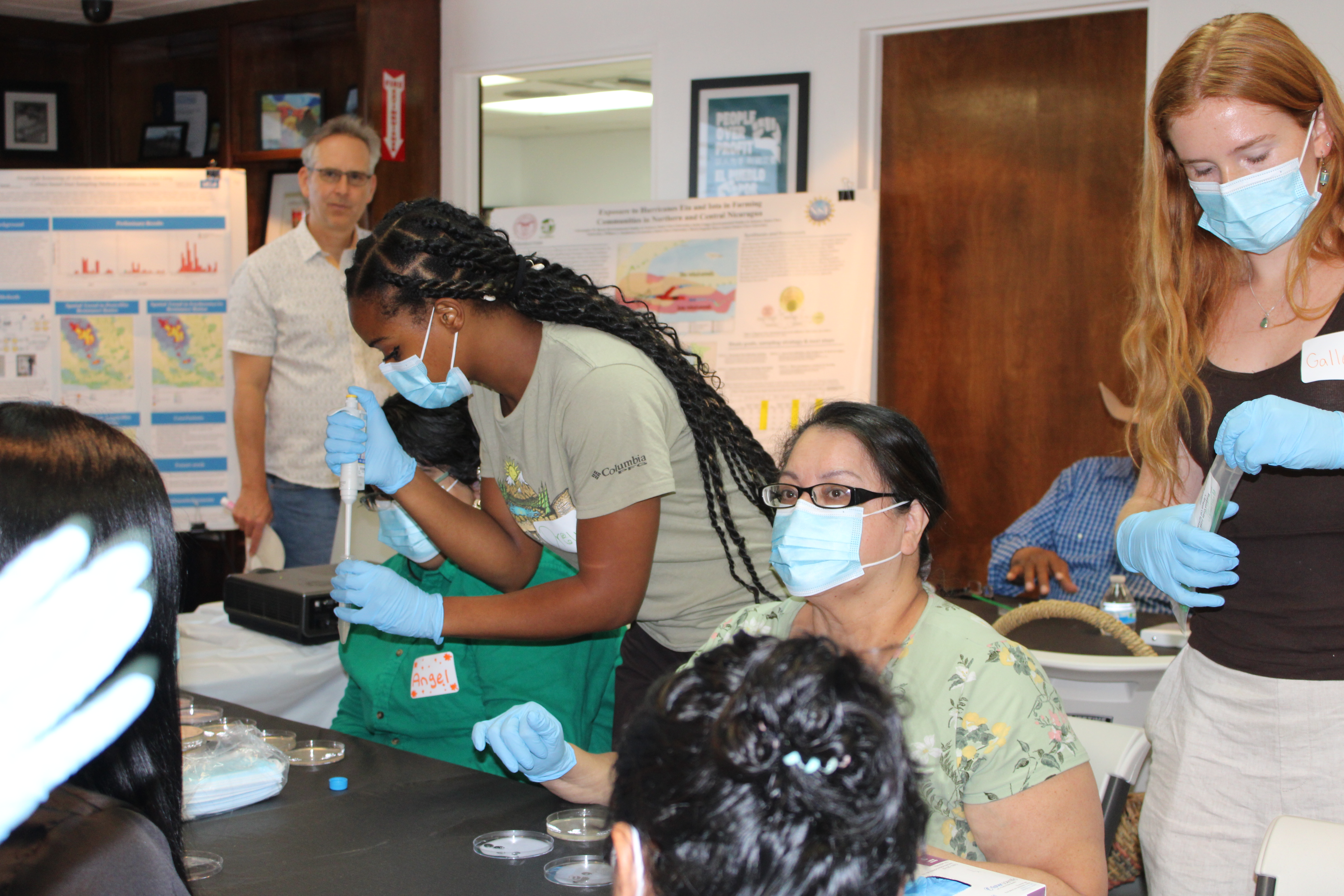 UCLA Students and residents committee members during a demo on how to process a dust sample to identify antibiotic resistance