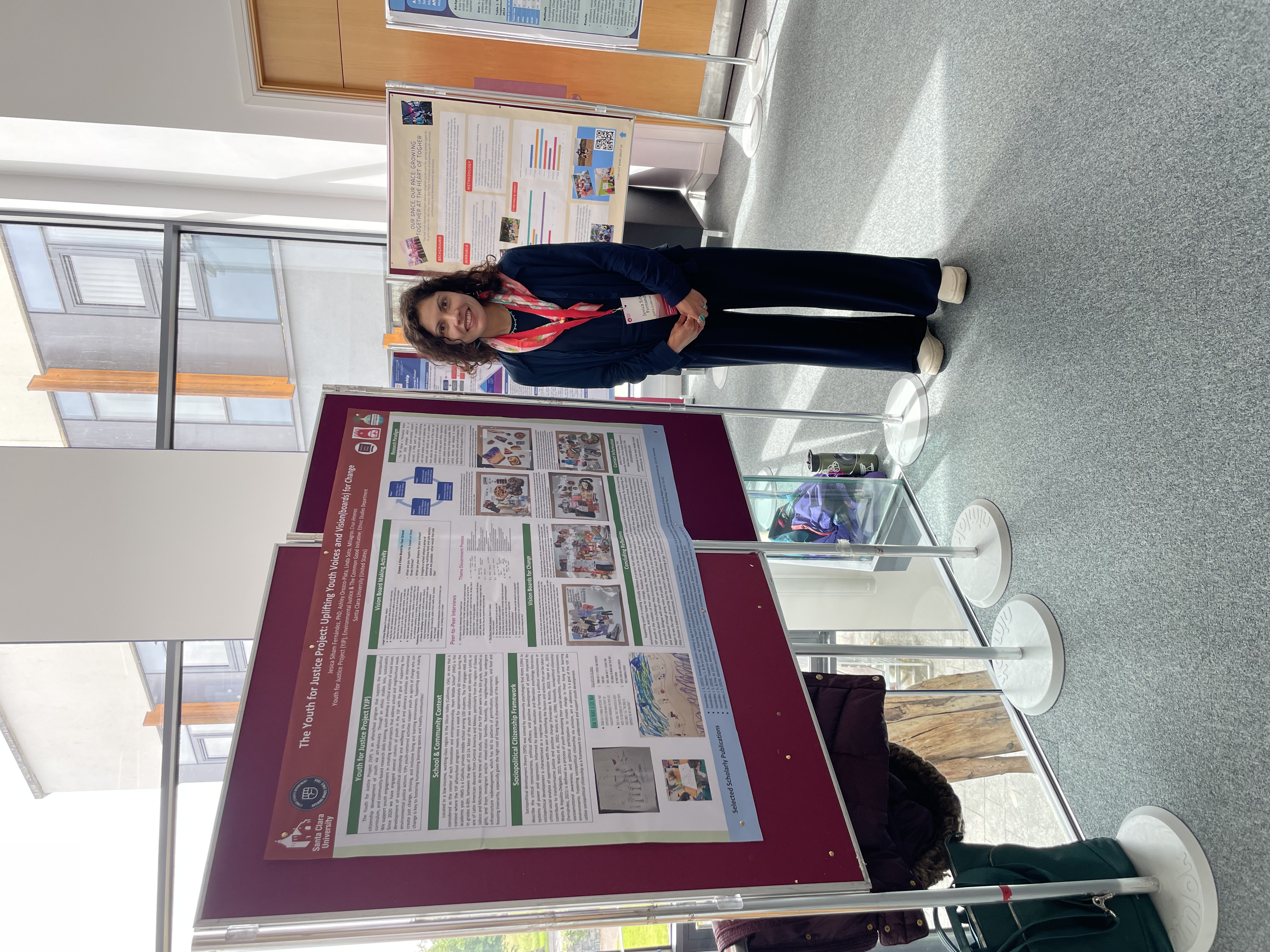 J Fernandez posing infront of her presentation