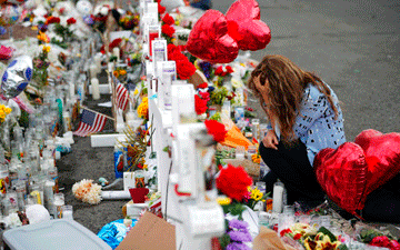 Woman grieving in El Paso