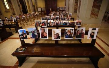 church pews covered with photos of members unable to attend services