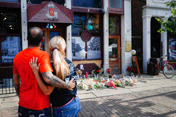 Couple standing in front of memorial